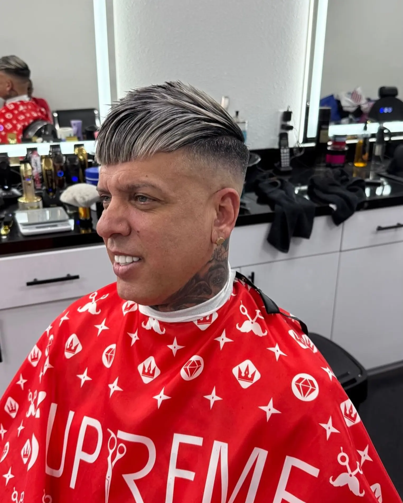 Clean skin fade with a crisp razor lineup and beard edge